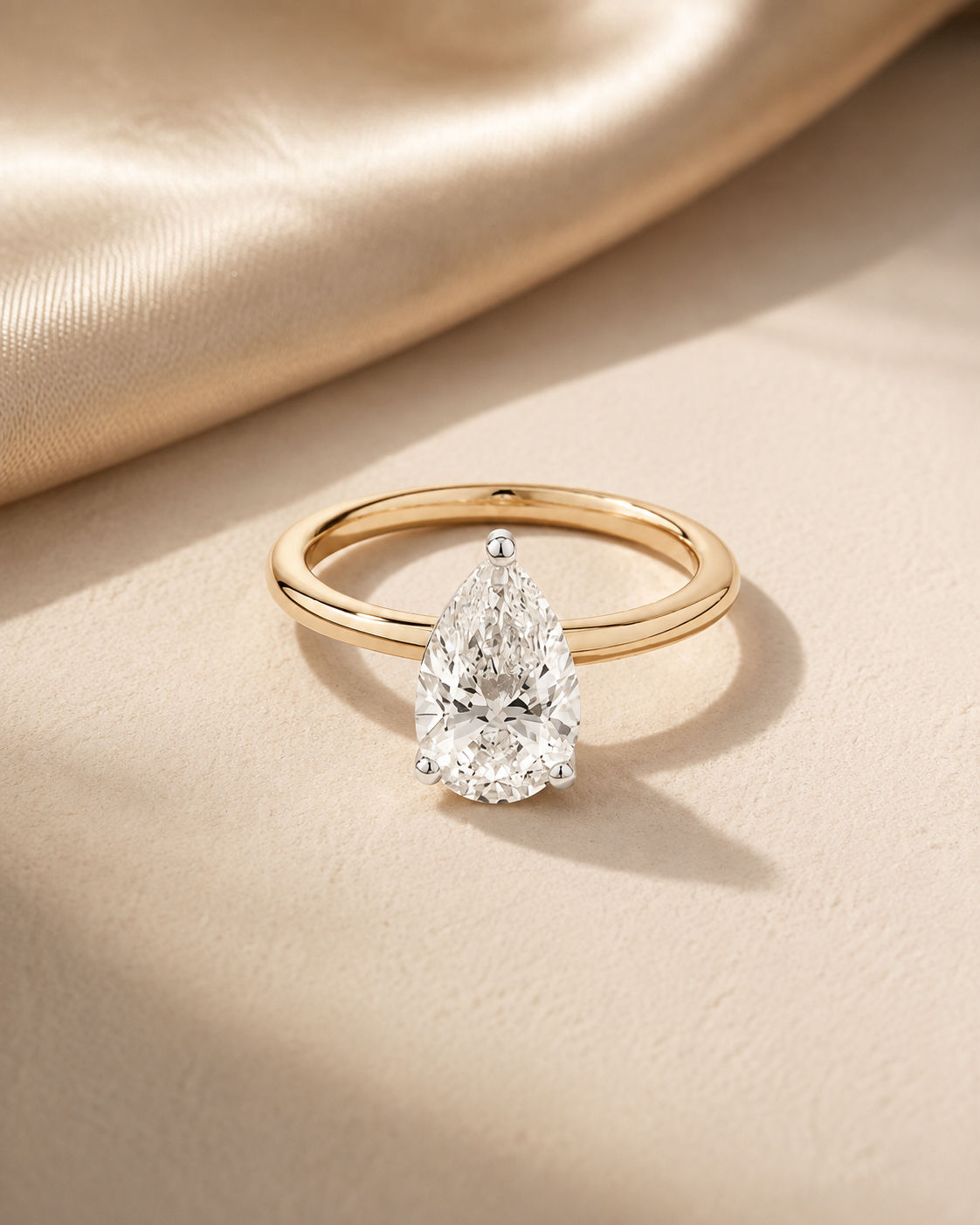 Jocelyn Pear Lab Diamond Engagement Ring on silk fabric