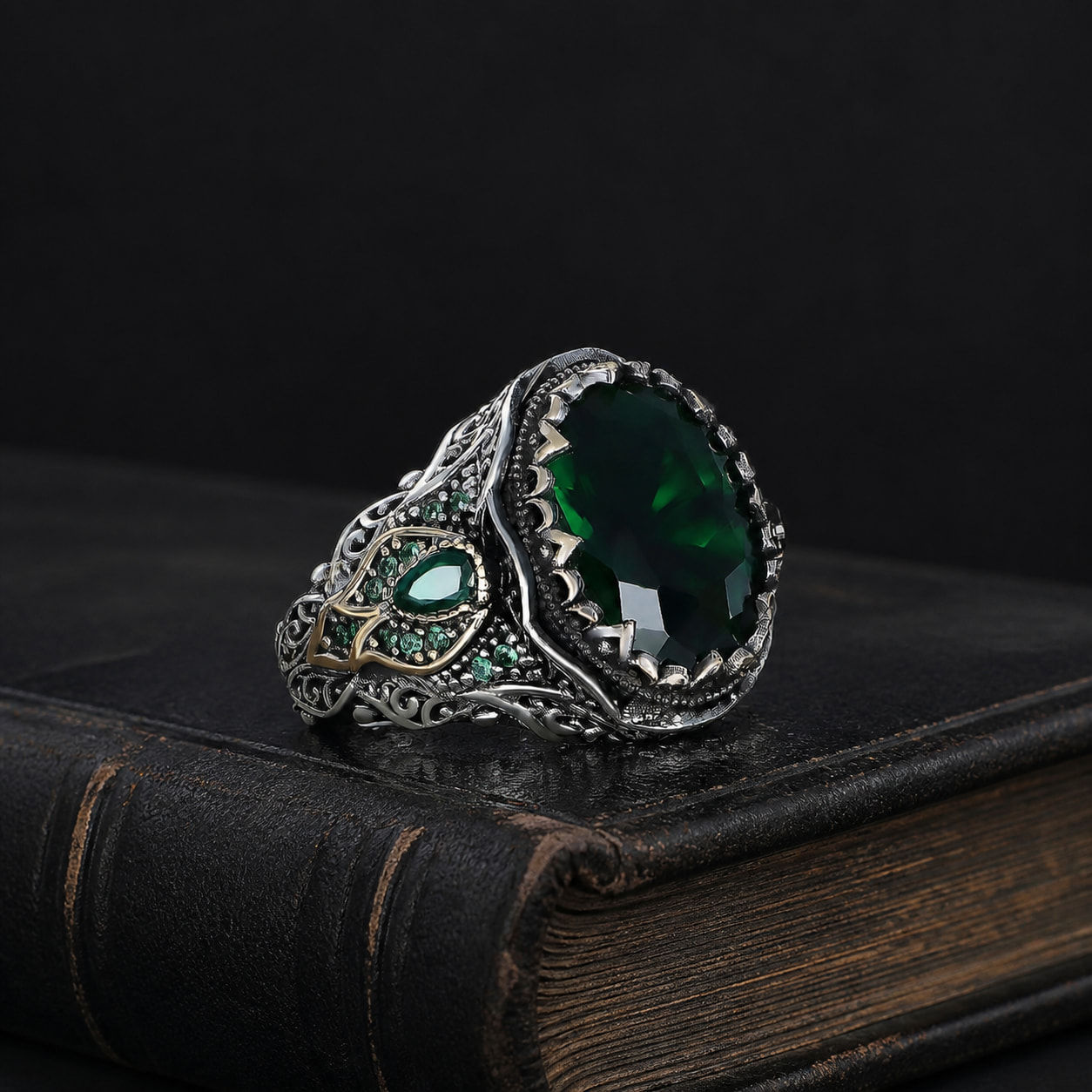 Ottoman Motif Green Zircon Men's Silver Ring on a black leather book
