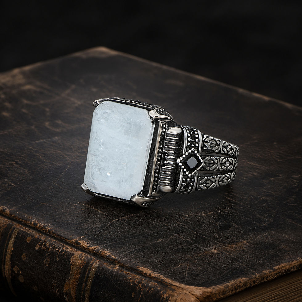 Rectangular White Paraiba Ornate Sterling Silver Men's Ring displayed on an aged black leather antique book