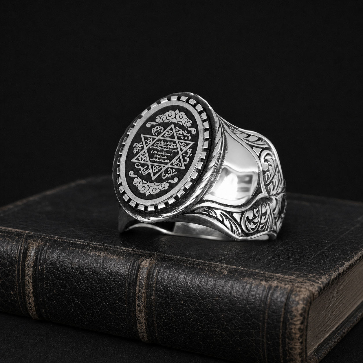 Seal of Solomon Beaded Sterling Silver Men's Ring on a black leather book