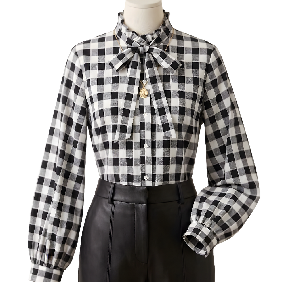Mannequin display of Black and White Tie-Neck Blouse posed with faux leather pants.