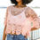 Thumbnail: women modeling pink cropped crochet top with pair of jeans