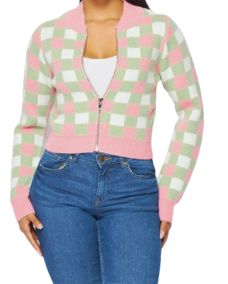 Model posing in a zip-up cropped pink and green sweater cardigan.
