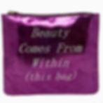 Metallic purple cosmetic bag with the phrase “Beauty Comes From Within (this bag)” printed on the front.