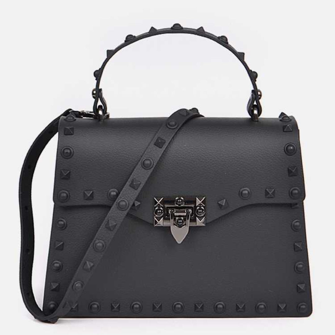 Close-up view of black matte messenger crossbody bag with sleek modern design and adjustable strap