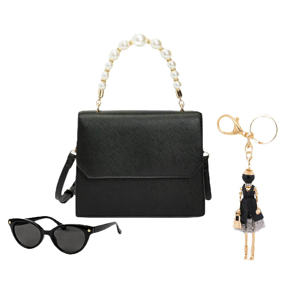 High angle view of a leather tassel bag charm hanging from a stylish handbag