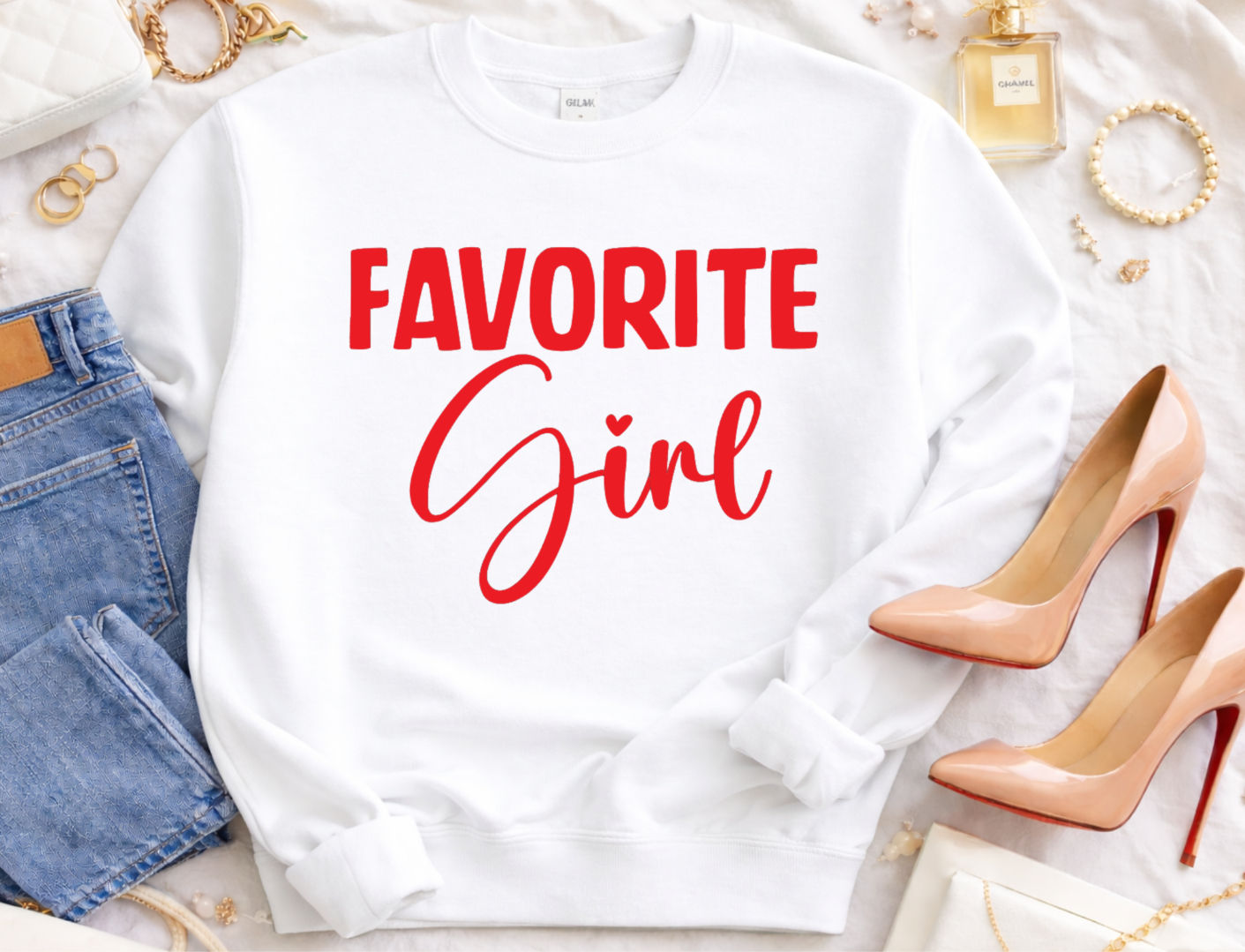 Flat-display of Favorite Girl sweatshirt in white with bold Red fancy script.
