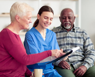 cheerful-young-woman-doctor-having-conversation-with-senior-patients copy.jpg