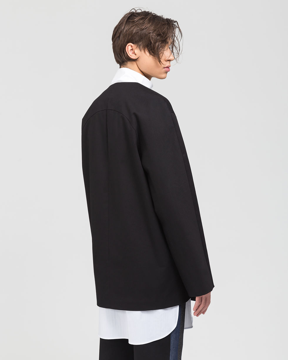 Collarless double-breasted cotton jacket.