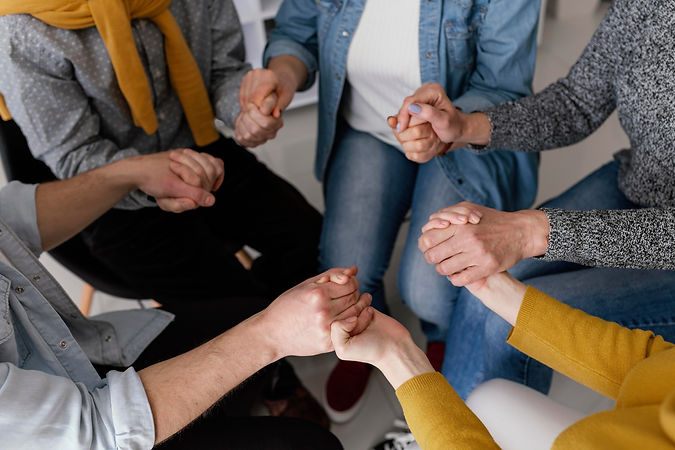 grup-therapy-session-holding-hands.jpg