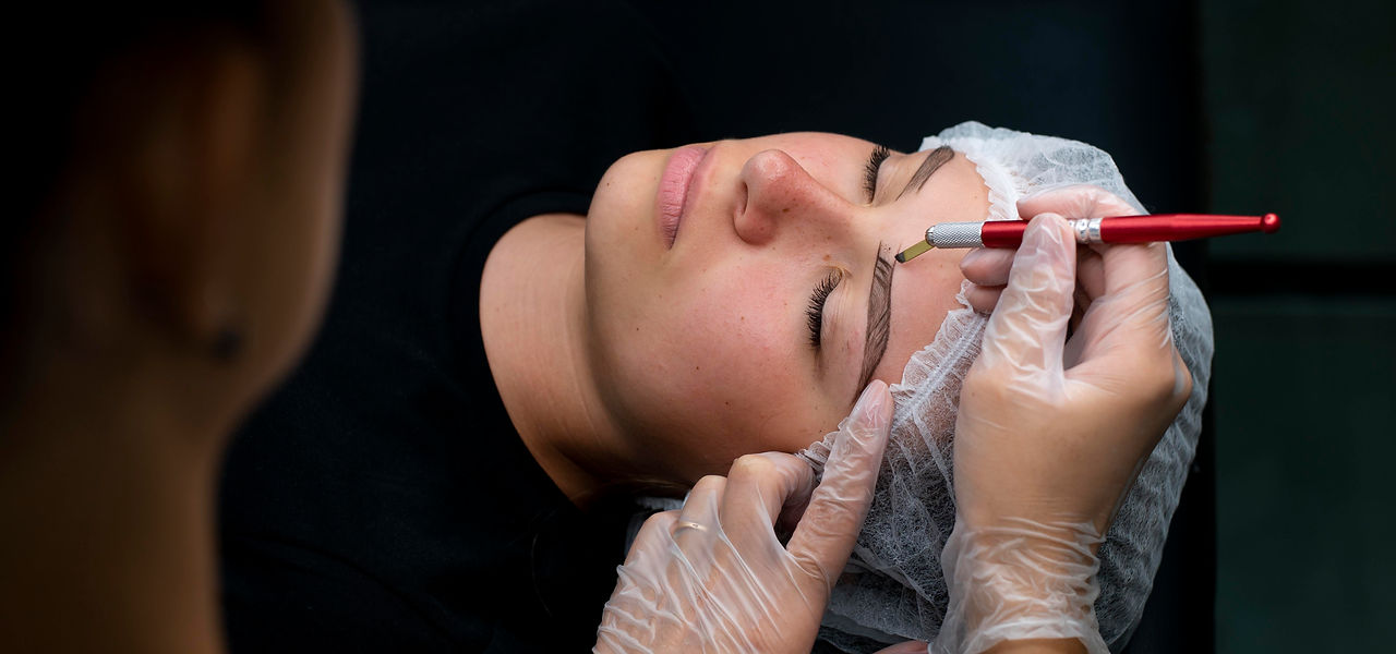 beautician-doing-microblading-procedure-woman-beauty-salon.jpg