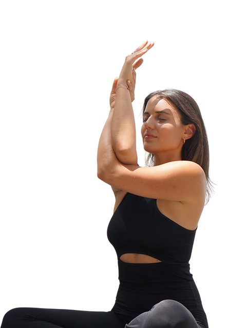 Flowithdidi yoga guide seated cross-legged with eagle arms, eyes closed in soft light, calming meditation practice.
