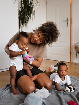 full-shot-mother-taking-care-babies.jpg