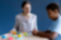 boy-doing-occupational-therapy-session-with-psychologist.jpg