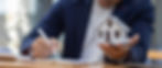 close-up-house-model-with-business-man-signs-a-purchase-contract-or-mortgage-for-a-home-re