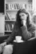 medium-shot-woman-posing-chair-black-white.jpg