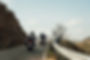 motorbikers-on-mountain-road-driving-a-empty-road-e1655957990441.jpg