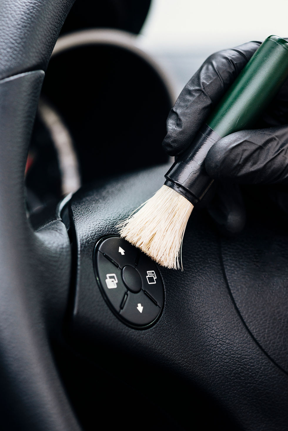 close-up-person-cleaning-car-interior.jpg