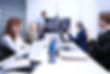 alt="employees on a zoom conference"
