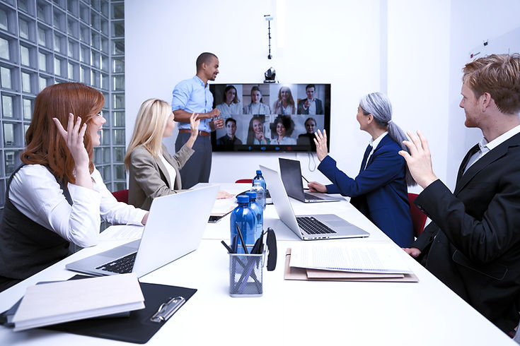 alt="employees on a zoom conference"
