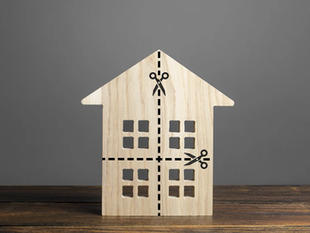 A house with lines indicating places to cut it horizontally and vertically