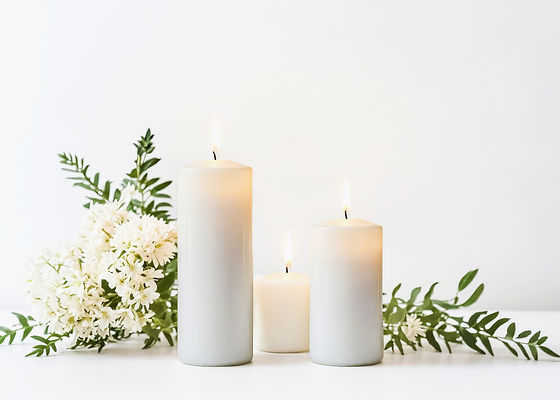 Ivory candles with white flowers and greenery — elegant event decor