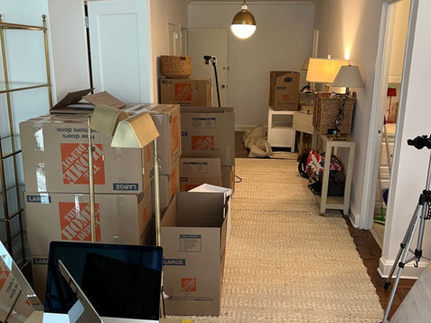 Office packed and prepared for relocation, with labeled boxes and equipment staged by VoltoVerse Movers.