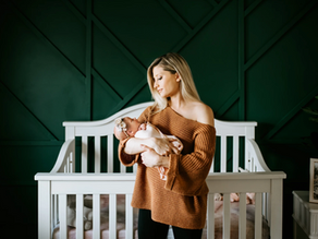 A serene moment as a mother cradles her newborn in a cozy nursery, exuding warmth and tenderness.