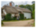 One of several thatched cottages after the ford
