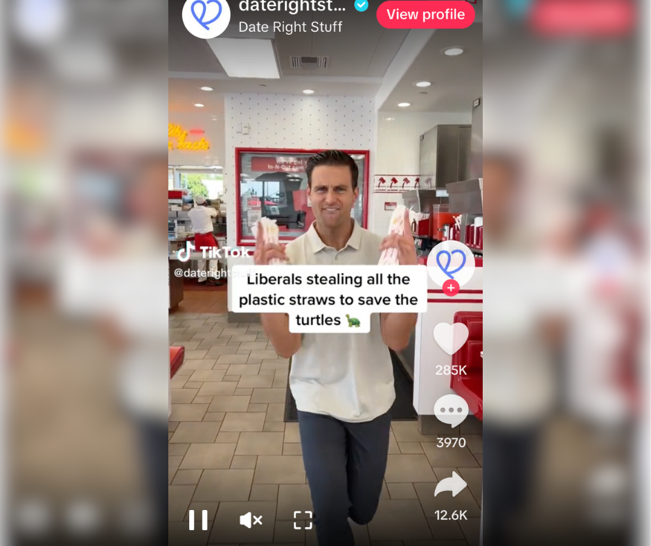 John McEntee appears in a TikTok video from the conservative dating app The Right Stuff, holding a bundle of plastic straws in an In-N-Out restaurant. A caption on screen reads, “Liberals stealing all the plastic straws to save the turtles 🐢,” reflecting the satirical, anti-liberal tone of the account’s content.