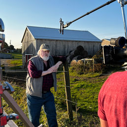 Film set on farm with equipment in foreground
