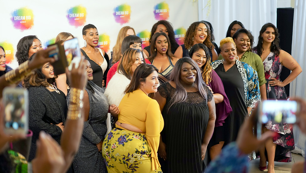curvy models posing at a fashion show