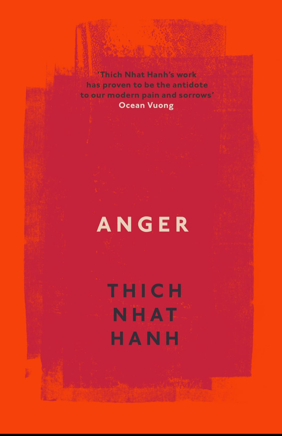 Orange and pink book cover reading ANGER by Thich Nhat Hanh, with a quote by Ocean Vuong at top.