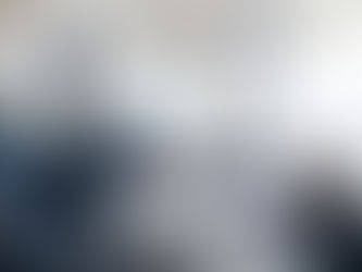 Man in a business meeting using an interactive screen while giving a presentation