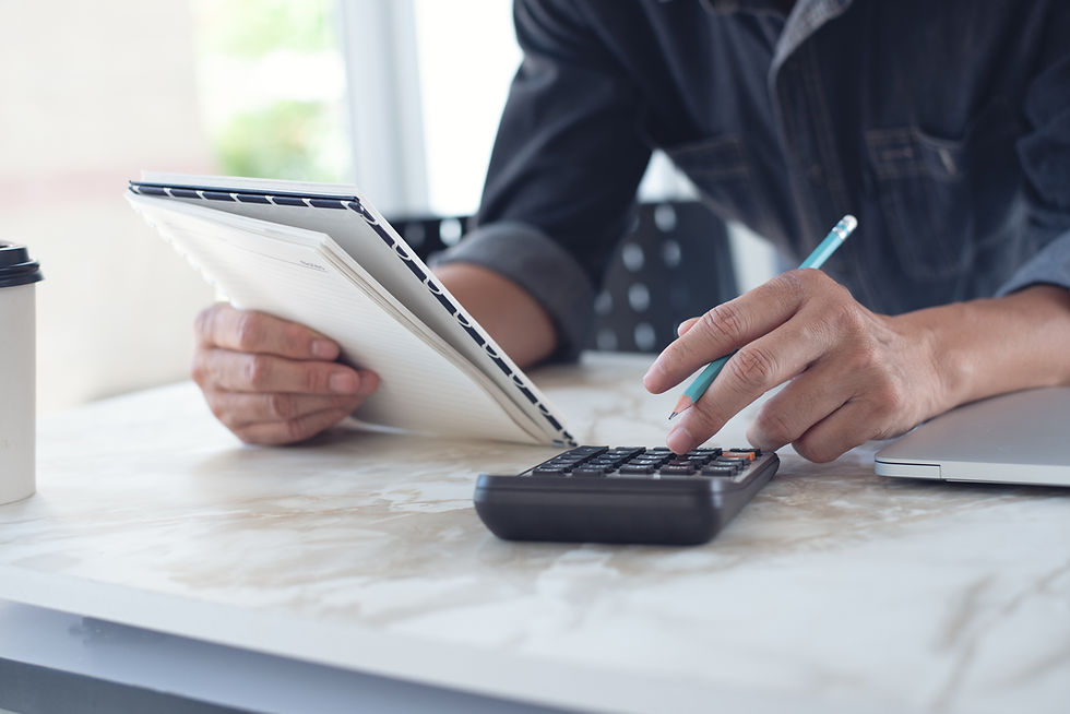 Business owner calculating costs and reviewing financial data