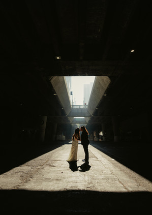 moody eloping photo under a bridge 