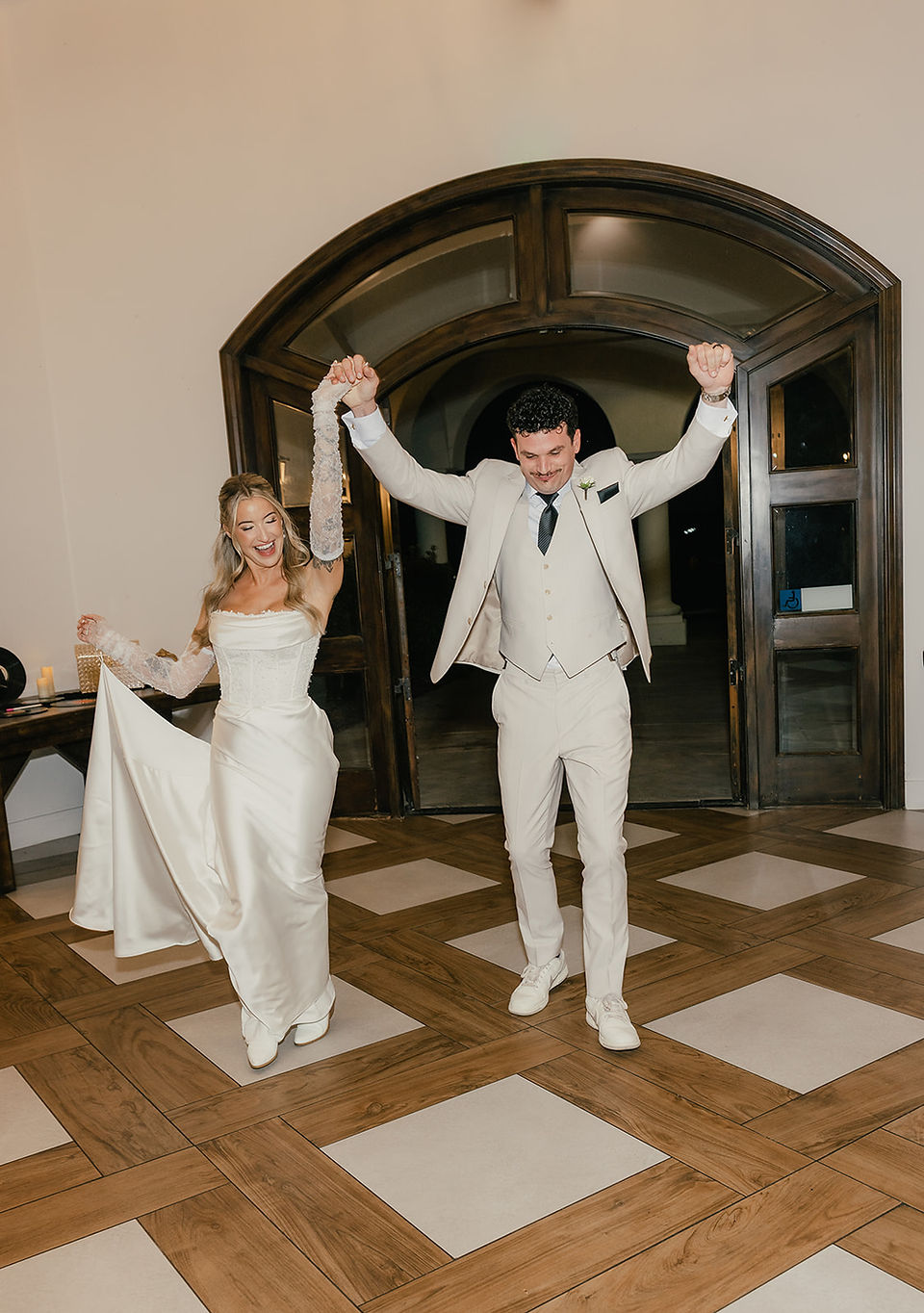Bride and groom make their grand entrance into their Sterling Hills wedding reception in Camarillo.