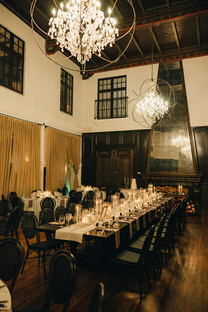 Candlelit round reception table setting in the Grand Hall at the Ebell of Long Beach