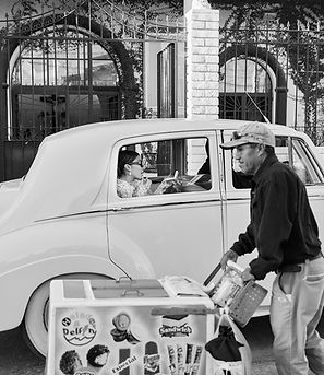 Bride in vintage car with street vendor passing by in San Miguel de Allende, captured by documentary wedding photographer Rene Porto