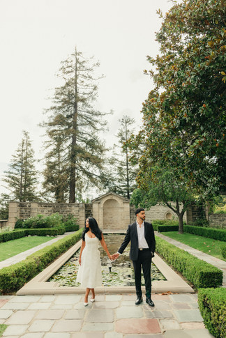 couple in front of fountain at greystone mansion 