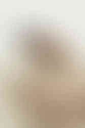 couple snuggling at the elopement beach location