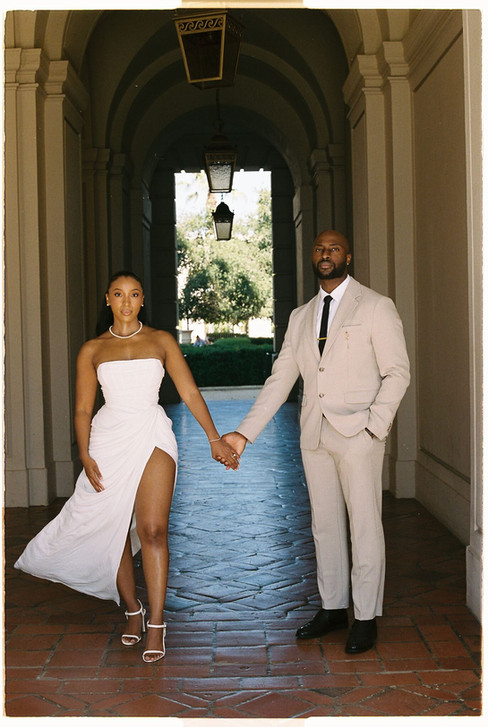 film photo of bride and groom holding hands at pasadena city hall