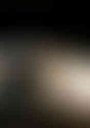 cinematic malibu beach engagement photos under sea cave with golden sunset reflections