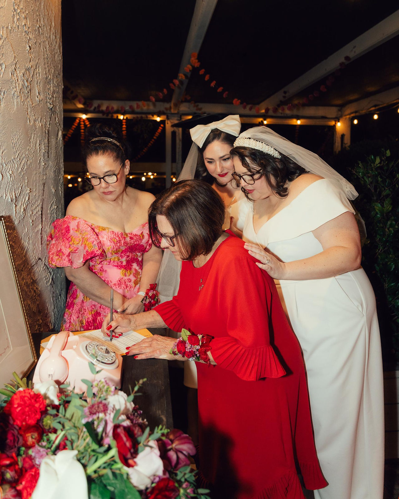 Guest signing wedding book during intimate reception at La Paloma Cafe in Santa Barbara