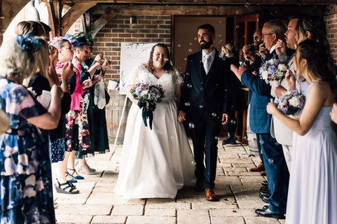 Bride and groom walking down the isle 