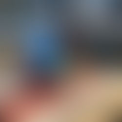 A volunteer sands a signage post at Whistler Sailing