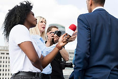 close-up-interviewee-with-microphone-taking-statements.jpg