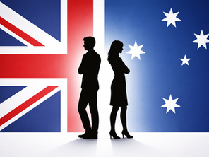 Silhouette male and female standing back to back with background of flags from Britain and Australia