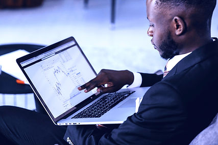 A man pointing at his laptop screen_edit