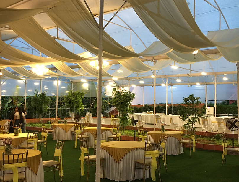Covered lawn area at Peacock Grove outdoor wedding venue in Bangalore